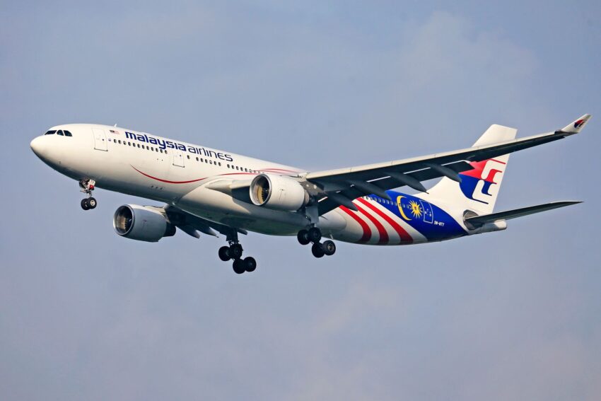 photo of a passenger airplane in the sky